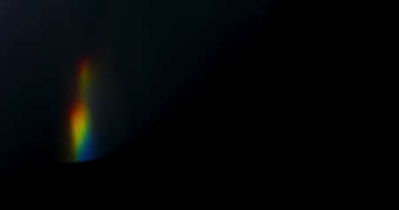 Prism Rainbow Light Flares Overlay on Black Backgroundの写真素材