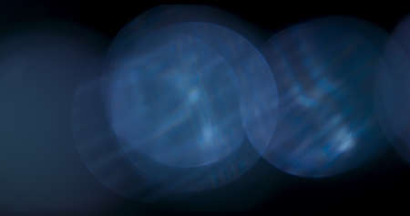 Blue Light Flare Prism Rainbow Light Flares Overlay on Black Backgroundの写真素材