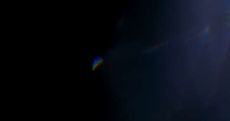 Spectrum Light Flare Prism Rainbow Light Flares Overlay on Black Backgroundの写真素材