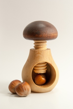 Wooden nutcracker mushroom and nut
