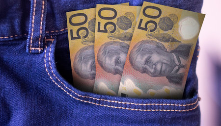 Australia 50 Dollars Banknotes in Pocket of Jeansの写真素材