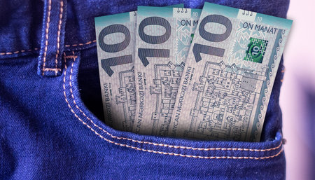 Bunch of 10 Azerbaijan Manat banknotes in a jeans pocket a concept of spendingの写真素材