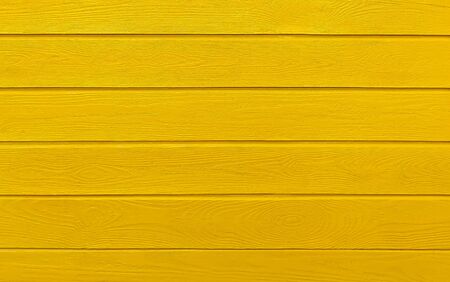 Colorful wooden boards painted in yellow. Yellow wood background.の写真素材