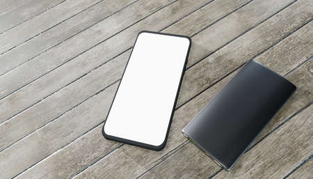 modern smartphone mockup with empty screen and powerbank on wooden table. 3d render.