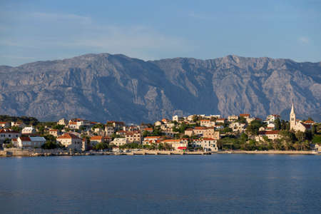 Picturesque village Sumartin on south-east of Brac island in Croatia, on the background Biokovo mountainの写真素材