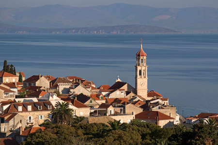 Panorama of village Sutivan on north west of island Brac in front of blue Adriatic in Croatiaの写真素材