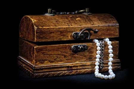 chest with treasures isolated on blackの写真素材