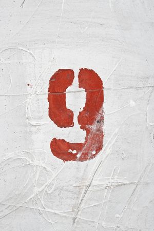 Number on weathered old white wallの写真素材
