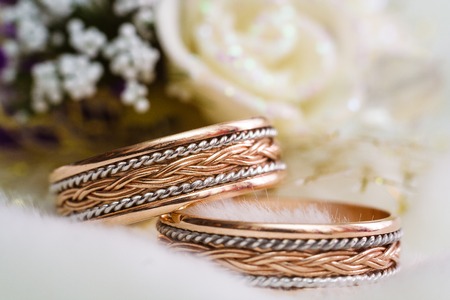 Beautiful wedding rings on blurry background macroの写真素材