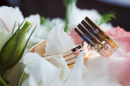 Beautiful wedding rings on blurry background macro