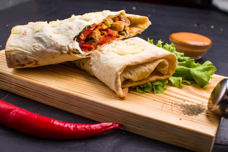 Homemade fries on a table with ingredients and cutlery around. Concept: healthy food, diet, fastfood.の写真素材