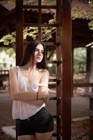 Concept: gritty, millennial. Gorgeous beautiful young woman photoshoot in abandoned location presenting the contrast of fashion and grunge.の写真素材