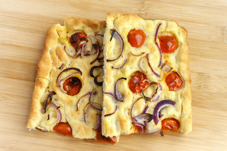 Focaccia with garlic and tomato - two slices on centerの写真素材
