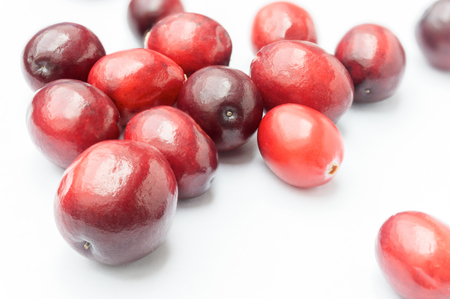 Some Fresh Cranberries on white backgroundの写真素材
