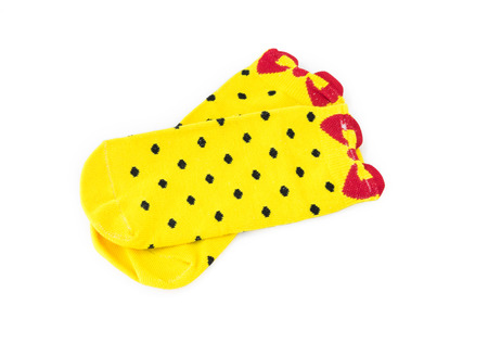 Cute yellow socks on white backgroundの写真素材