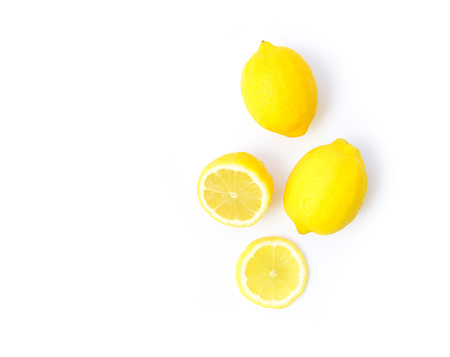 Closeup top view fresh lemon fruit and slice on white background