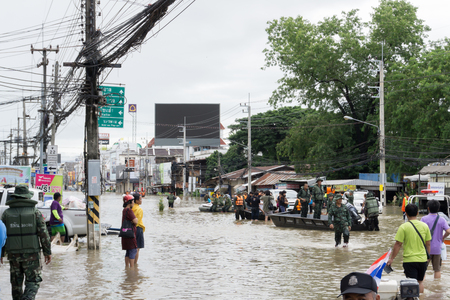 SAKON NAKHON, THAILAND - JULY 29, 2017 : Transpotration people with water floodedのeditorial素材