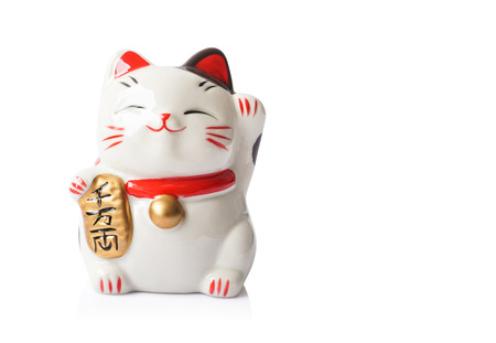 Maneki Neko ceramic japanese lucky cat isolated on white backgroundの写真素材