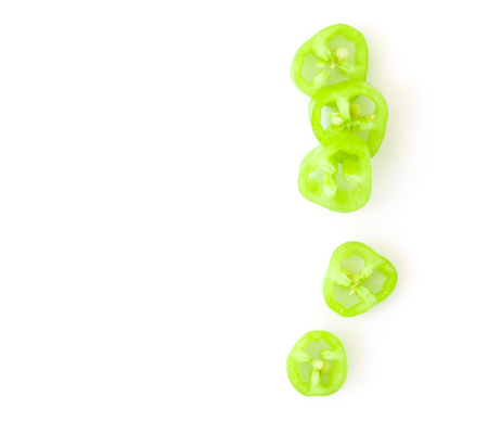 Top view green chilli pepper with sliced on white background, raw food ingredient concept