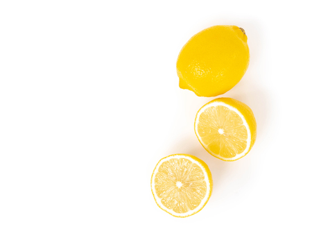 Closeup top view  fresh lemon fruit slice on white background, food and healthy conceptの写真素材