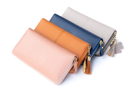 Closeup modern woman wallet fashion on white backgroundの写真素材
