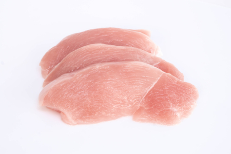 Raw chicken breast isolated on white background, ingredient for make cookingの写真素材