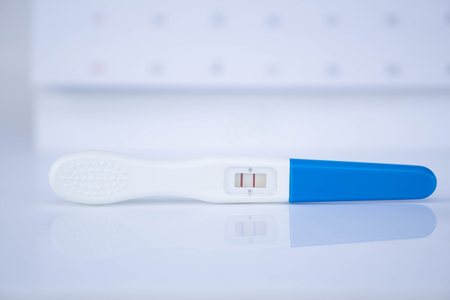 Closeup pregnancy test with calendar background, health care concept, selective focusの写真素材