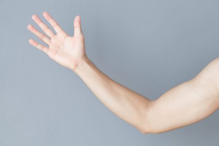 Close up man hand with grey background, health care conceptの写真素材