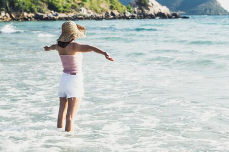 Closeup woman looking to sea with relax feeling in tropical summer season, Hoilday conceptの写真素材