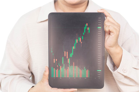 Business woman hand holding digital tablet computer with graph of Binary option for trading...