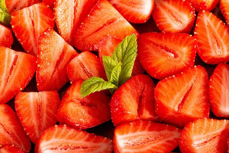 Mousse cake with profiteroles inside and strawberriesの写真素材