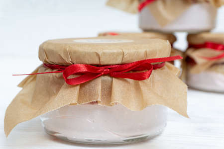 Marshmallow with jam in a transparent jarの写真素材