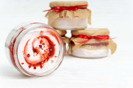 Marshmallow with jam in a transparent jarの写真素材