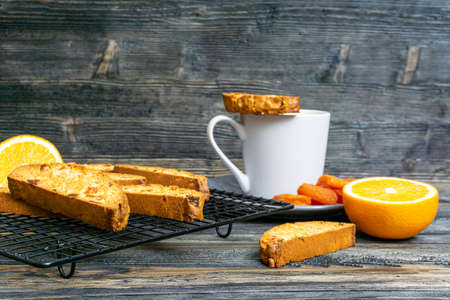 Biscotti with orange filling on a dark table