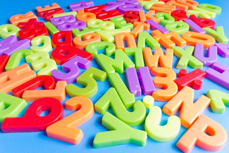 Colorful alphabet on blue backgroundの写真素材