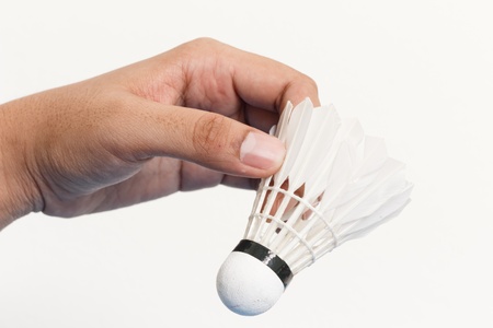Hand holding shuttlecockの写真素材