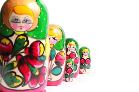 Bright painted nested dolls on white backgroundの写真素材