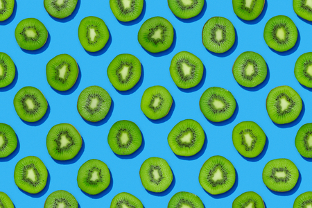 Seamless kiwi pattern on blue backgroundの写真素材