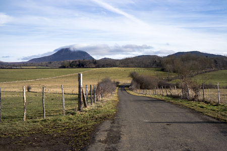 Country road with views of the Puy de Domeの写真素材