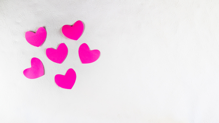 Valentines day. Pink hearts on a white wallの写真素材
