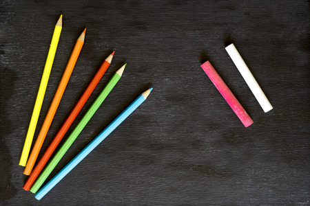 Blackboard and color pensの写真素材