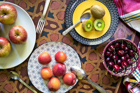 Fresh organic fruits on wooden tableの写真素材