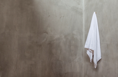 Hanging White Towel Near The Corner of Bath Room Wallの写真素材