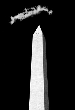 Obelisk with cloudy blue sky background, Washington monument, Washington, DC, capital city of the USA.の写真素材