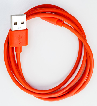 Red USB cable isolated on white background, smile human face