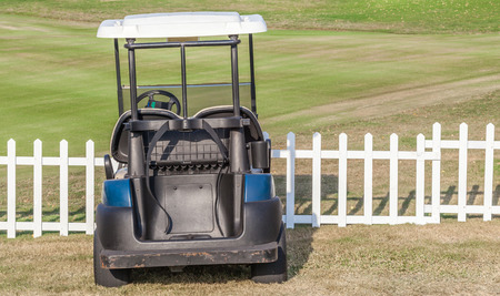 Golf cart parks around the golf course waiting for golfers.の写真素材