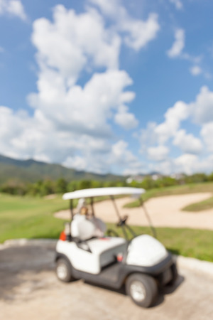 Abstract blurred photo of golf cart and beautiful blue sky background.の写真素材