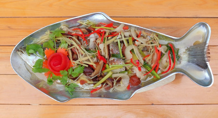 Steamed sea-bass with spicy lemon sauce, tasty Thai food dishes.
