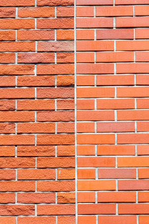 Comparing two textures, smooth and rough red brick wall background.の写真素材