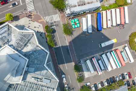 Hakodate, Hokkaido, Japan- June 9, 2016. Tourists bus parked in car park area of Goryokaku tower.のeditorial素材